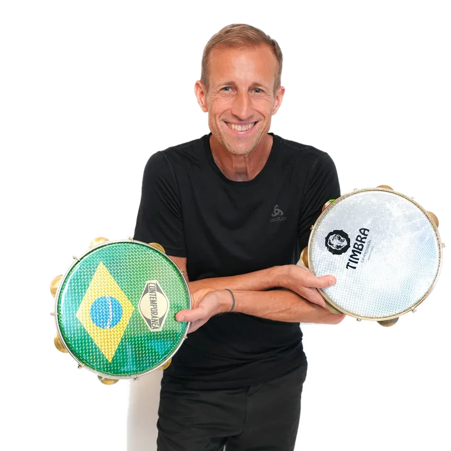 Percussionist with pandeiro and Brazilian percussion, wearing dark clothes