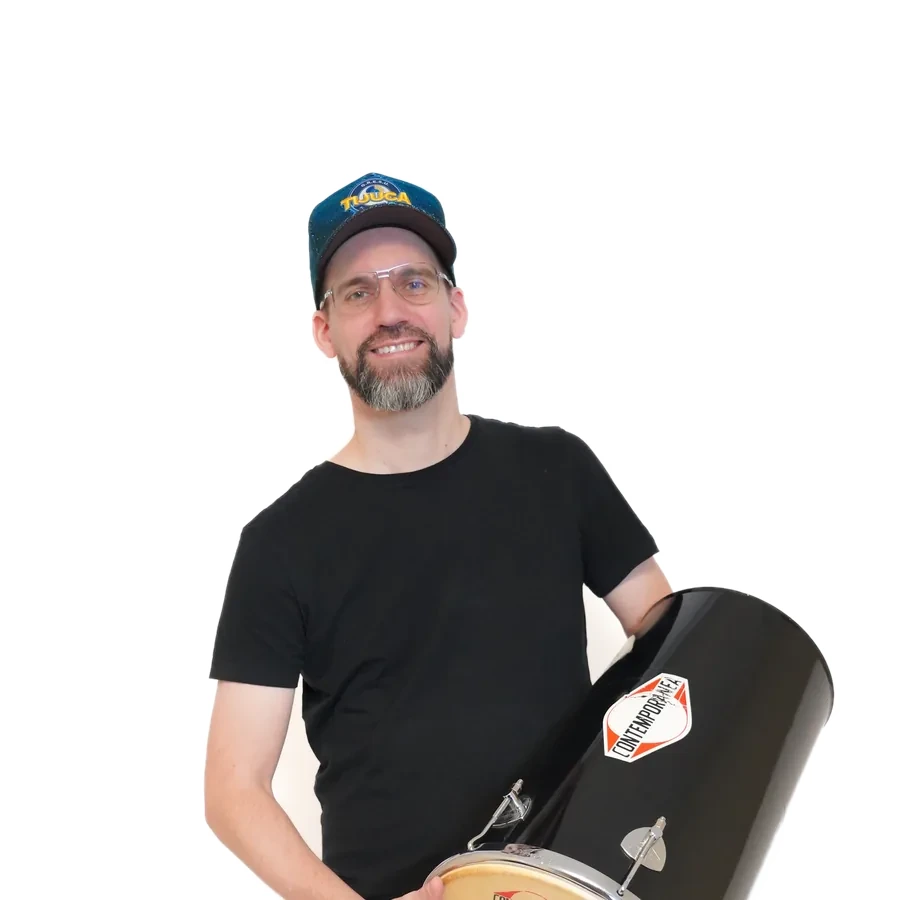 Samba musician with surdo in dark clothes